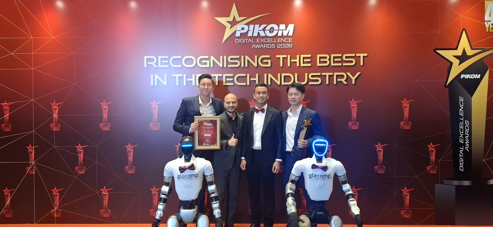 Catalyst AI team at the PIKOM Digital Excellence Awards 2026, holding a certificate and trophy